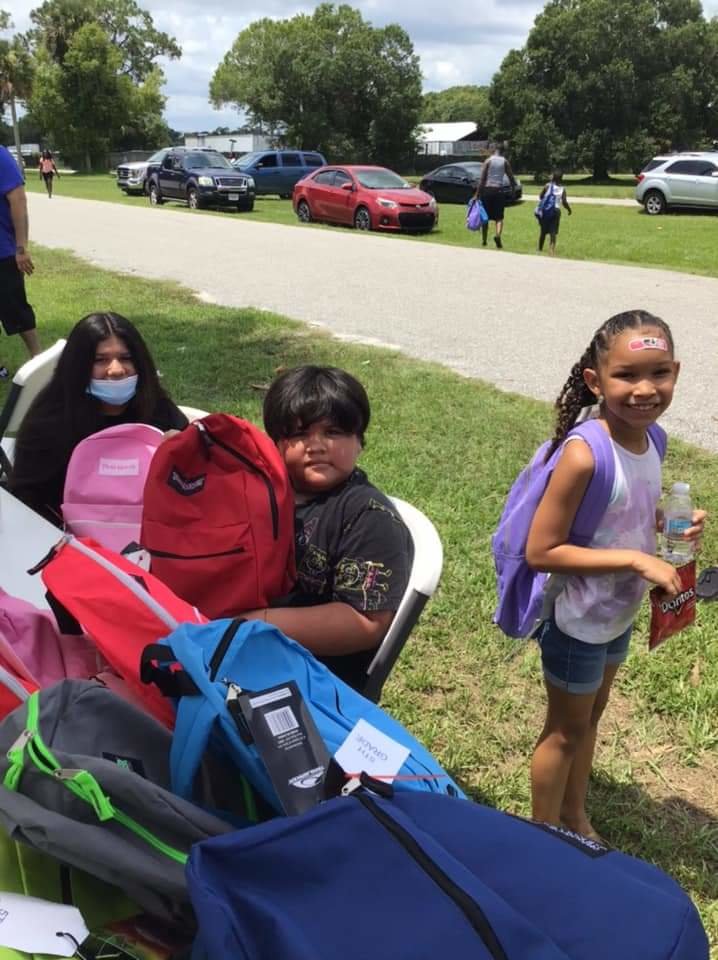 Children in the Douglas Park neighborhood were excited to receive backpacks filled with school supplies.